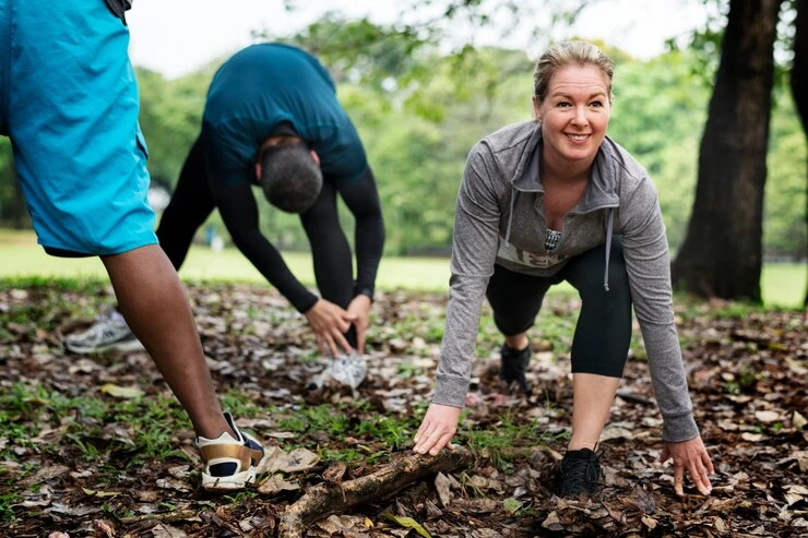 group-of-people-warming-up-and-stretching-outdoors